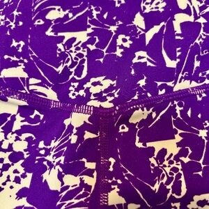 Purple and White Floral Patterned Fabric. FABLETICS